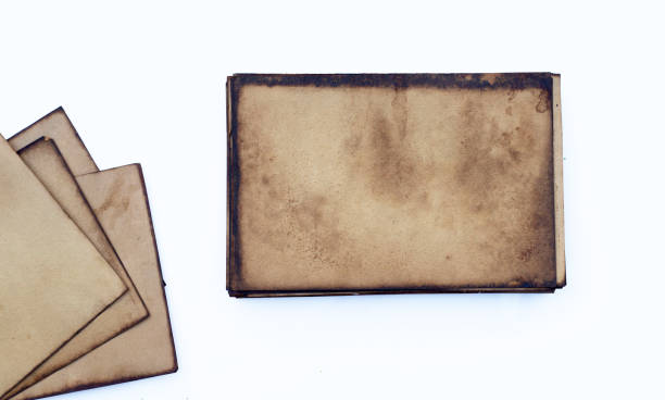 istock Old brown paper grunge background. 1386967849