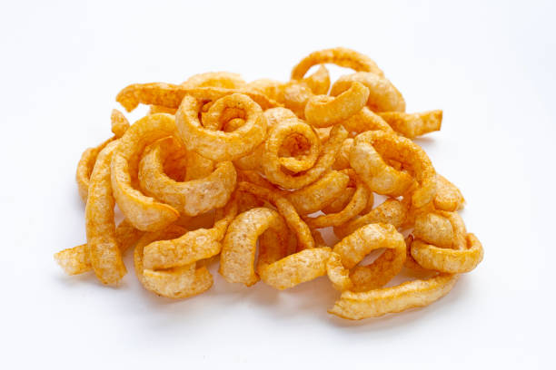 istock Fried crispy pork rinds on white background. 1386967972