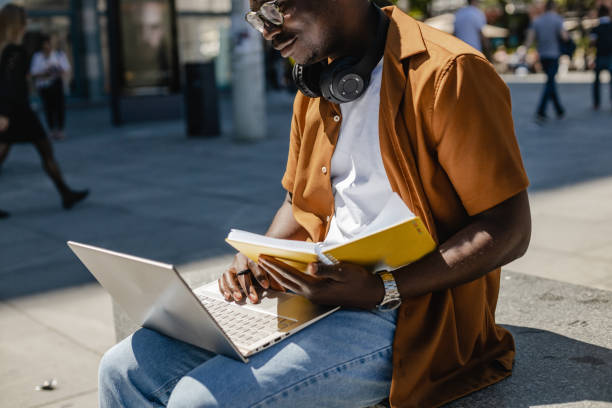 istock African American student learning outdoors 1386971194