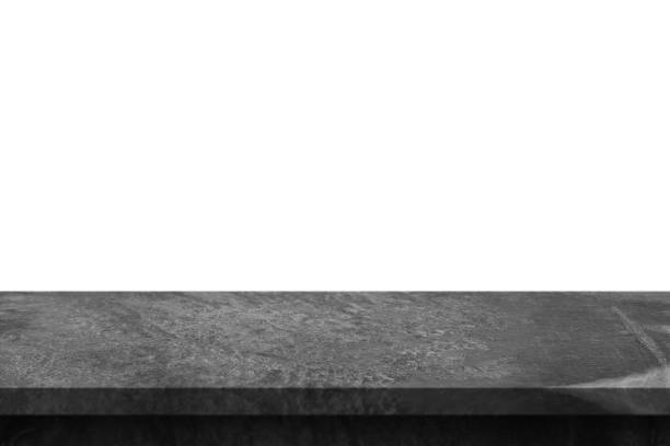 istock Black marble stone table top isolated on white background 1386973820