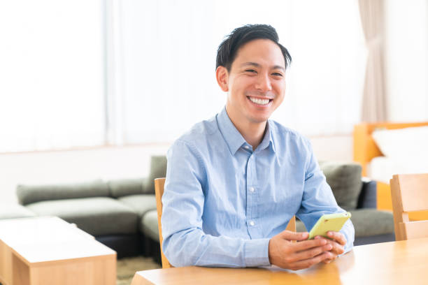istock young man who uses smart phone 1386981240