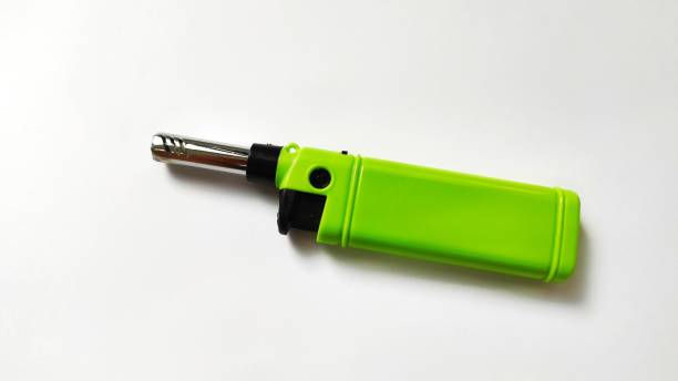 istock Green  gas lighter on a white background 1386983032