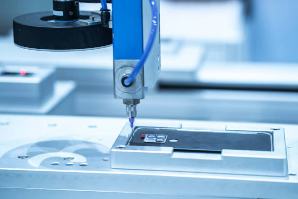 istock High precision and technology of nozzle device and needle of automatic glue dispenser machine (glue injection) for mobile phone 1386983101