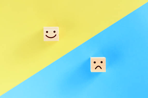 istock Building blocks with good mood and bad mood expressions on them. 1386987643