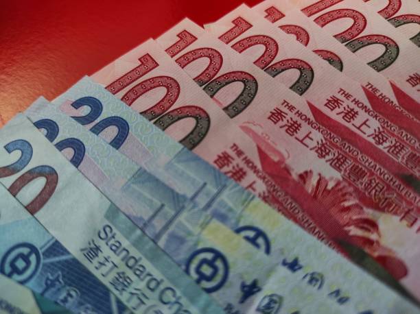 istock Hong Kong Dollar banknote on red background 1386988895
