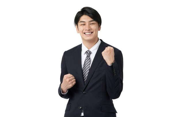 Asian businessman cheering with a guts pose