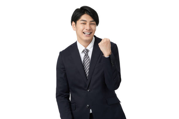 istock Asian businessman cheering with a guts pose 1386990069