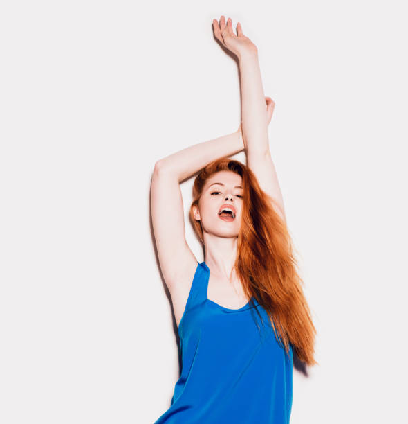istock Shot of a young woman posing against a studio background 1386992033