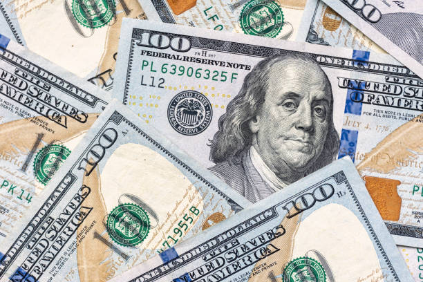 istock $100 Bills Money US Currency Background 1386994095