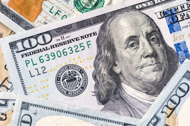 istock $100 Bills Money US Currency Background 1386994108