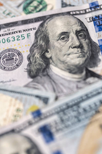 istock $100 Bills Money US Currency Background 1386994124