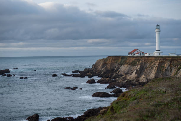 istock Point Arena Lighthouse on the cliffs with stormy skies 1386994156