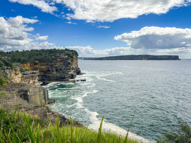istock Rocky headland with waves and dramatic sky 1386994942