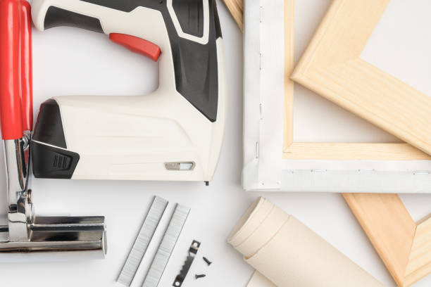 istock Tools for stretching canvas on a wooden stretcher. Printing photos on canvas 1386996024