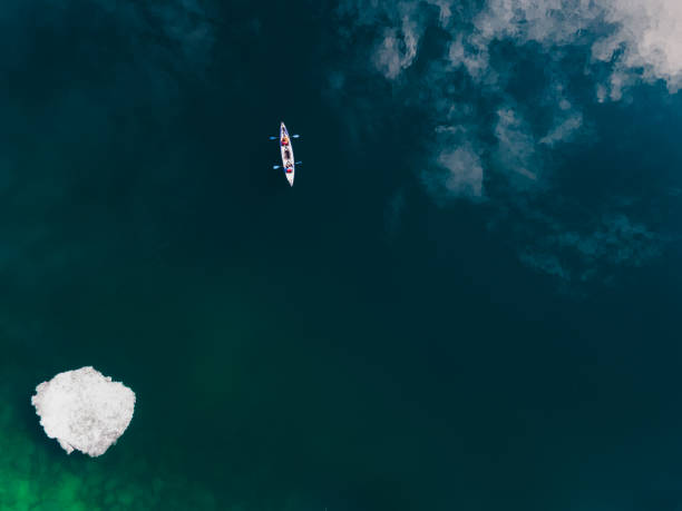 istock Kayak sailing on the lake. Aerial drone view. 1387002802