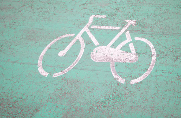 Traffic sign printed on asphalt on the track for cyclists.