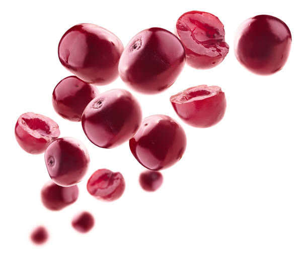 istock Red cherry berries levitate on a white background 1387005874
