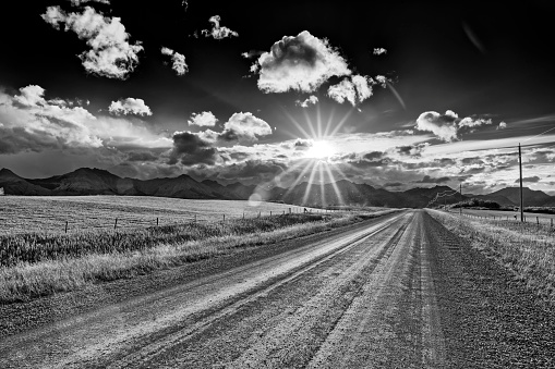 Rural highway with dramatic clouds in Southern Alberta Canada