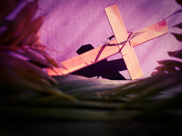 Christ carrying the Cross on Good Friday... sepia tone with silhouette and dark sky.