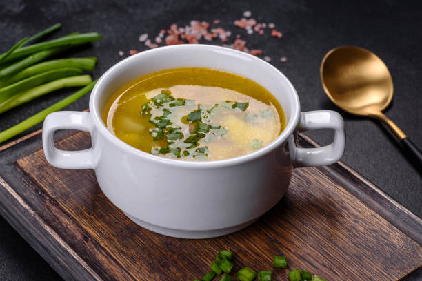 istock Fresh pea soup in bowl on black background. Cooking at home 1387011137