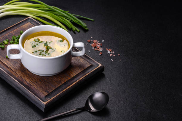 istock Fresh pea soup in bowl on black background. Cooking at home 1387011139