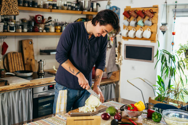 istock man preparing food in home kitchen 1387013055