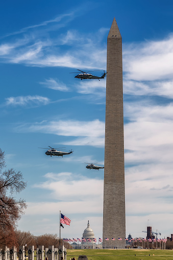 American President helicopters in flight at the Washington Monument in Washington, DC, USA
