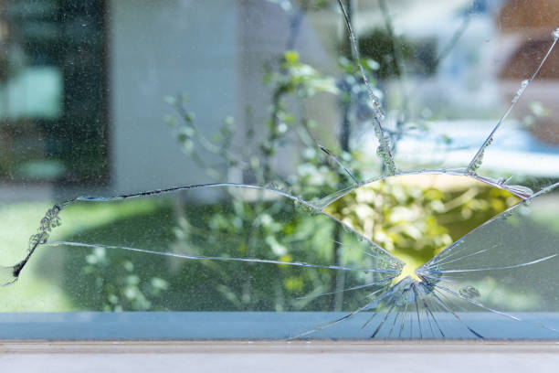 istock make repairs in the room and remove the old window, the broken window 1387014648