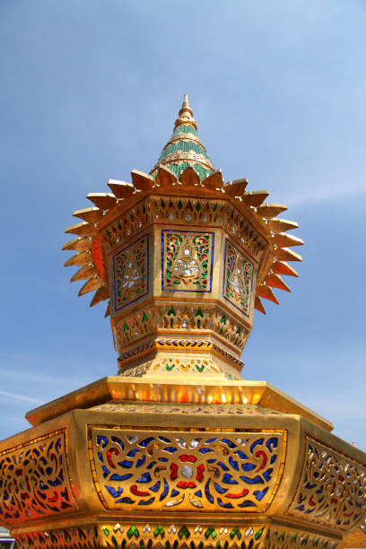 istock Architectural detail from Buddhist temple over sky 1387015014