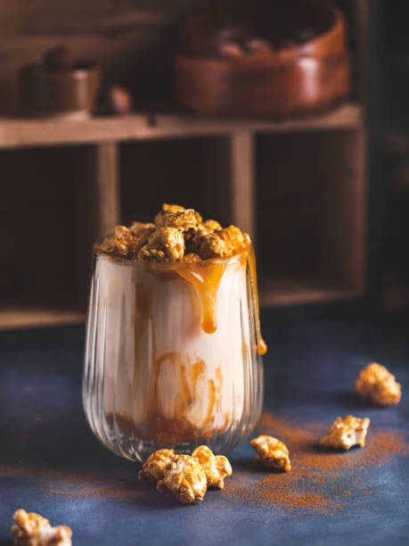 istock Popcorn milkshake beverage glass decorated with caramel salted syrup. 1387015079