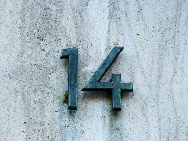 istock Metal house number on a wall 1387016345