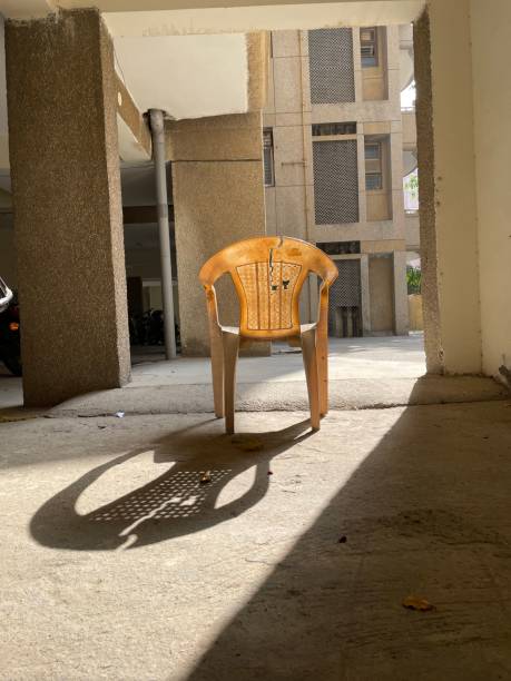 istock Old plastic chair in the sunlight 1387016371