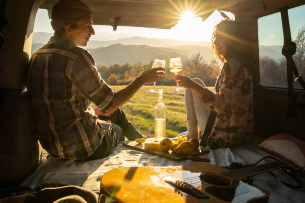 A couple enjoying a picnic and country views stock photo