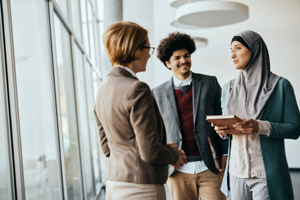 multiracial-business-team-talking-on-a-meeting-at-corporate-office.jpg?s=612x612&w=0&k=20&c=akh9FVxOI2G4oDpiV4xrQA826CIYveuBX6pgFvG9IsY=