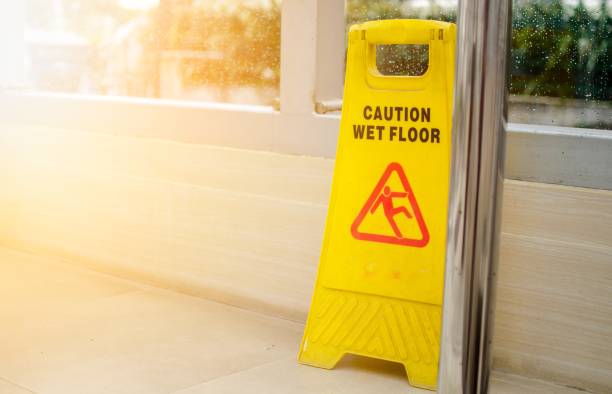 istock Yellow Wet Floor Caution Sign with Light leaks. 1387019784