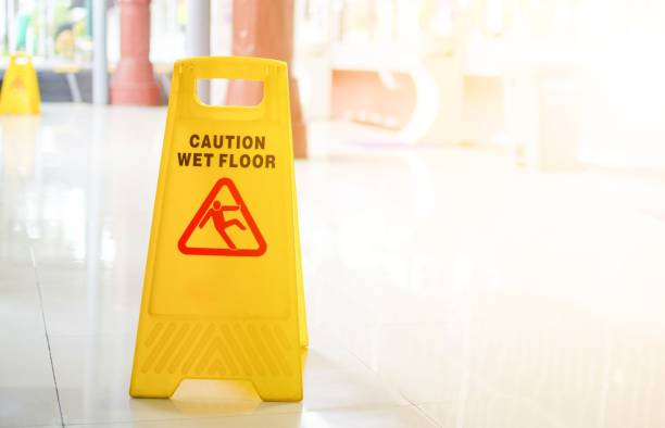 istock Yellow Wet Floor Caution Sign with Light leaks. 1387020383