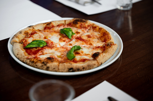 Close-up Italian pizza margherita on table.