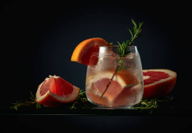 istock Cocktail gin tonic with ice, grapefruit, and rosemary. 1387032904