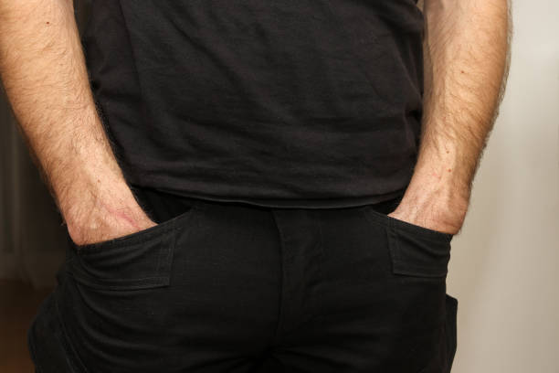 istock A Man Standing And Putting His Hands In Pockets. 1387035439
