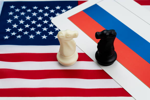 istock Two chess knights on American and Russian flag 1387035532