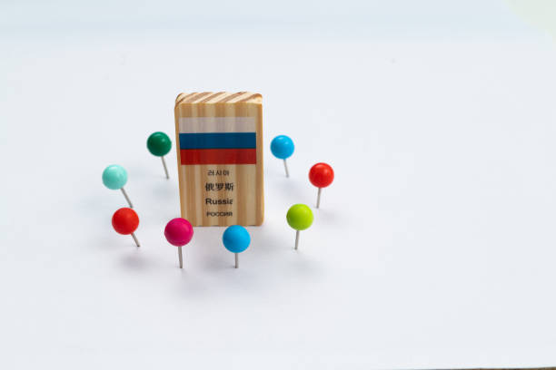 istock Russia flag surrounded by thumbtacks 1387035624