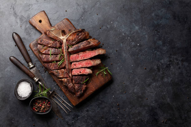 istock Grilled porterhouse beef steak. Sliced T-bone 1387040373
