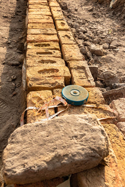 istock Measure tape it the under-construction wall 1387042527