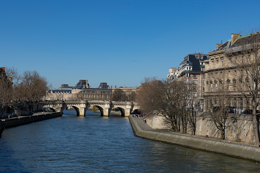 The River Seine at midday with the Pont Neuf in the background.