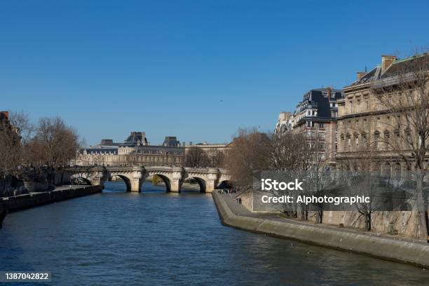 The River Seine At Midday With The Pont Neuf In The Background Stock Photo - Download Image Now