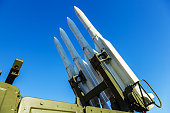 Missiles of the air defense system on sky background.