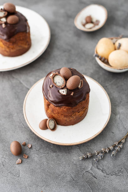istock Traditional Ukrainian Easter cake with chocolate glaze. Easter table with traditional dessert. Easter background. Ukrainian kulich 1387045402