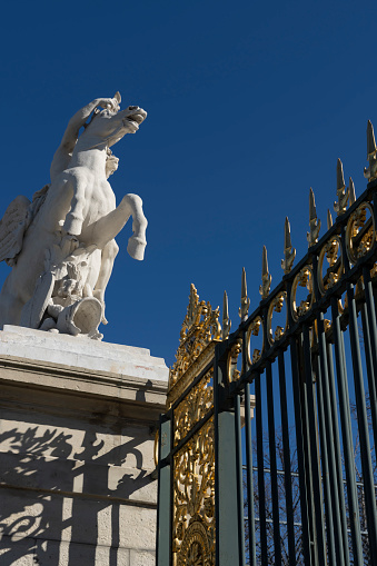 Statue on the gates of Jardin des Tuileries near the Louvre, Paris, France.