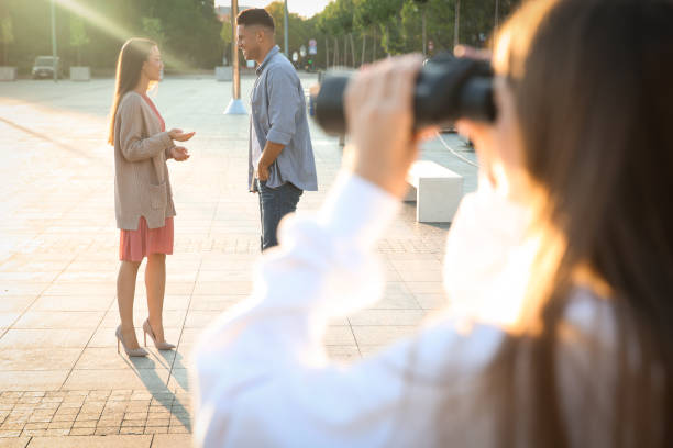 Jealous ex girlfriend with binoculars spying on couple outdoors, closeup Jealous ex girlfriend with binoculars spying on couple outdoors, closeup jealous ex girlfriend stock pictures, royalty-free photos & images