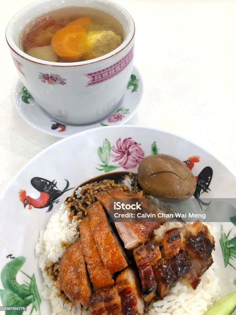 Chinese roasted duck and barbecue pork meal Close-up of a plate of Chinese roasted duck and barbecue pork rice and soup set meal Rice - Food Staple Stock Photo